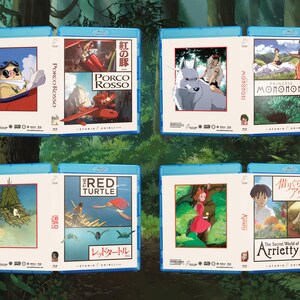 May include: Blu-ray movie cases featuring animated films. Titles include "Porco Rosso," "Princess Mononoke," "The Red Turtle," and "The Secret World of Arrietty." Each case has a blue border and features colorful artwork from the films.