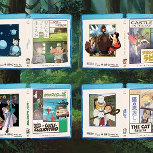 May include: A collection of Blu-ray movie cases featuring animated film artwork. The cases are in blue, with various illustrations and Japanese text. Titles include "Castle in the Sky," "The Boy and the Heron," and "The Cat Returns."