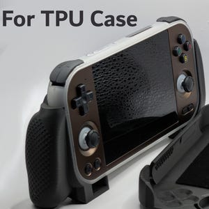 May include: A black and brown TPU case for a handheld gaming device. The case has a textured grip, a screen, and buttons. The text "For TPU Case" is visible in the upper left corner. The case is open, revealing the interior.