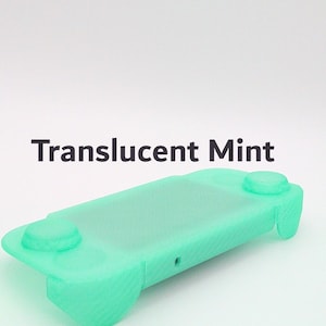 May include: A translucent mint green protective silicone cover for a handheld gaming console. The cover features cutouts for buttons and joysticks, with the text Translucent Mint printed in dark gray above the object on a white background.
