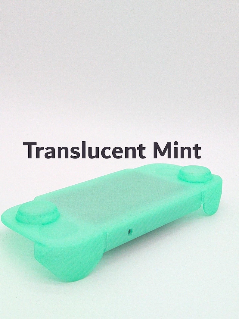 May include: A translucent mint green protective silicone cover for a handheld gaming console. The cover features cutouts for buttons and joysticks, with the text Translucent Mint printed in dark gray above the object on a white background.