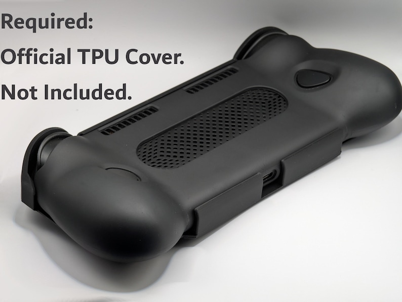 May include: A black TPU protective cover for a handheld gaming device, featuring a textured central mesh panel, ergonomic side grips, and precise cutouts for ports and buttons. The text "Required: Official TPU Cover. Not Included." is visible.