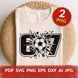 May include: A cream-colored t-shirt featuring a black graphic design of a soccer ball centered within the number 67, which appears to be shattering outward. A red circular badge in the top right corner displays the text 2 PNG, and the bottom text reads PDF SVG PNG EPS DXF AI JPG.