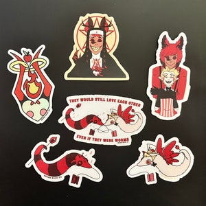May include: Set of five stickers featuring characters from the animated series Hazbin Hotel. The stickers are printed on white vinyl with red, black, and white details. The stickers feature the characters Angel Dust, Charlie, Vaggie, Alastor, and a worm couple. The stickers are all rectangular in shape and have rounded corners.