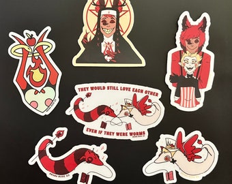 May include: Set of five stickers featuring characters from the animated series Hazbin Hotel. The stickers are printed on white vinyl with red, black, and white details. The stickers feature the characters Angel Dust, Charlie, Vaggie, Alastor, and a worm couple. The stickers are all rectangular in shape and have rounded corners.