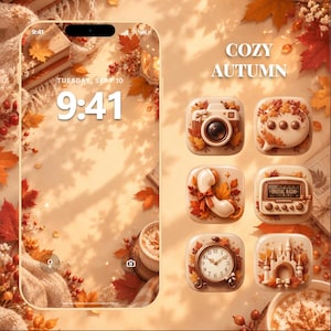 May include: A digital smartphone interface featuring a warm autumn-themed wallpaper with fallen leaves, books, and a coffee cup. The screen displays the time 9:41 and date Tuesday, Sept 10. Six 3D app icons show a camera, chat bubble, phone, radio, clock, and castle.