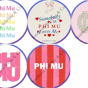 May include: A collection of round designs featuring the Greek letters Phi and Mu. Some designs include the text "Phi Mu" in various colors, while others have phrases like "Somebody at Phi Mu Loves Me" with heart accents. The designs are in a circular format.