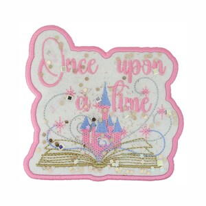May include: A pink and white patch with the words "Once upon a time" in pink script. The patch features a pink castle with blue turrets, an open book, and gold and silver embellishments. The patch has a pink border.