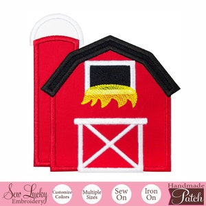 May include: Embroidered red barn patch with a black roof, white door, and a window filled with yellow hay. A white silo is attached to the barn. The patch is labeled "Handmade Patch" and "Sew Lucky Embroidery".
