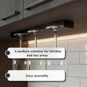 May include: A dark brown wine glass rack installed under a cabinet, holding three wine glasses. The rack is made of dark wood and has a modern design. Text on the image reads: "A modern solution for kitchen and bar areas", "Easy assembly", and "Creates an organized bar corner while saving space."