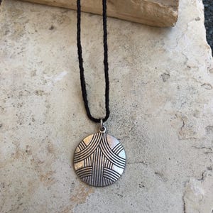 engraved sterling silver pendant with brown hemp cord necklace