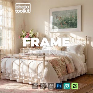 May include: A white metal bed frame with a floral patchwork quilt and white bedding, positioned in a room with a large rectangular picture frame hanging on the wall above the headboard, featuring the text FRAME MOCKUP and photo toolkit.