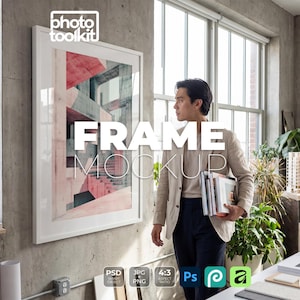 May include: A white framed art print with a modern architectural design in shades of red and gray hangs on a concrete wall. The words "FRAME MOCKUP" are displayed in large white letters. A person holds books in front of the frame.