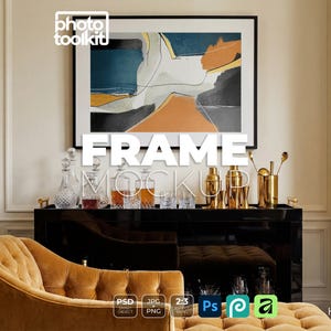 May include: A framed abstract art print with teal, orange, and gray shapes hangs above a black bar cart. The cart displays glassware, decanters, and gold bar tools. A tufted gold sofa is in the foreground. The image includes the text "FRAME MOCKUP".