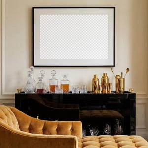 May include: A black bar cart with gold bar tools, cocktail shakers, and crystal decanters. A gold tufted chaise lounge is in the foreground. A large framed picture hangs on the wall.