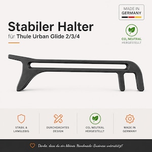 May include: A black, sturdy holder for Thule Urban Glide 2/3/4 strollers. The product is made in Germany and features a durable design. The text "Stabiler Halter" is displayed at the top of the image.
