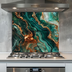 May include: A set of three ceramic mugs with a speckled, matte finish. Each mug features a different color: light blue, cream, and gray. The mugs have a simple, modern design and a comfortable handle.