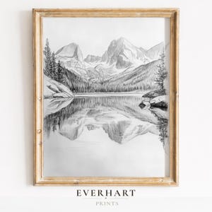 May include: A white ceramic mug with a black handle and the text "But First, Coffee" in a handwritten style. The mug is on a white surface. The mug is approximately 4 inches tall.