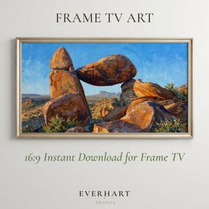 May include: A digital landscape painting displayed in a gold frame, featuring large orange and brown desert rock formations under a bright blue sky. The text FRAME TV ART and 16:9 Instant Download for Frame TV appear above and below the image.