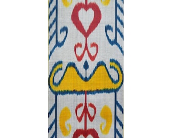 May include: A vertical textile pattern featuring repeating motifs. The design includes red hearts, yellow swirls, and a yellow mustache-like shape, all set against a light gray background with blue accents. The pattern is symmetrical and visually striking.
