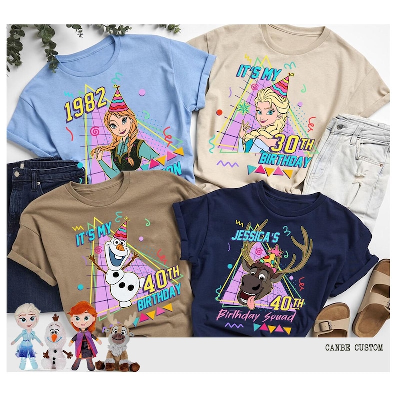 May include: Four t-shirts with cartoon characters and birthday themes. The shirts are light blue, tan, brown, and navy blue. Each shirt has a different design, including the text "1982", "30th Birthday", and "40th Birthday".