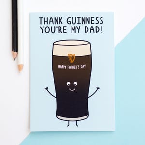 May include: A Father's Day card with a cartoon pint of Guinness. The card reads "THANK GUINNESS YOU'RE MY DAD!" and "HAPPY FATHER'S DAY." The pint has a smiling face, arms, and legs, with a gold harp logo.
