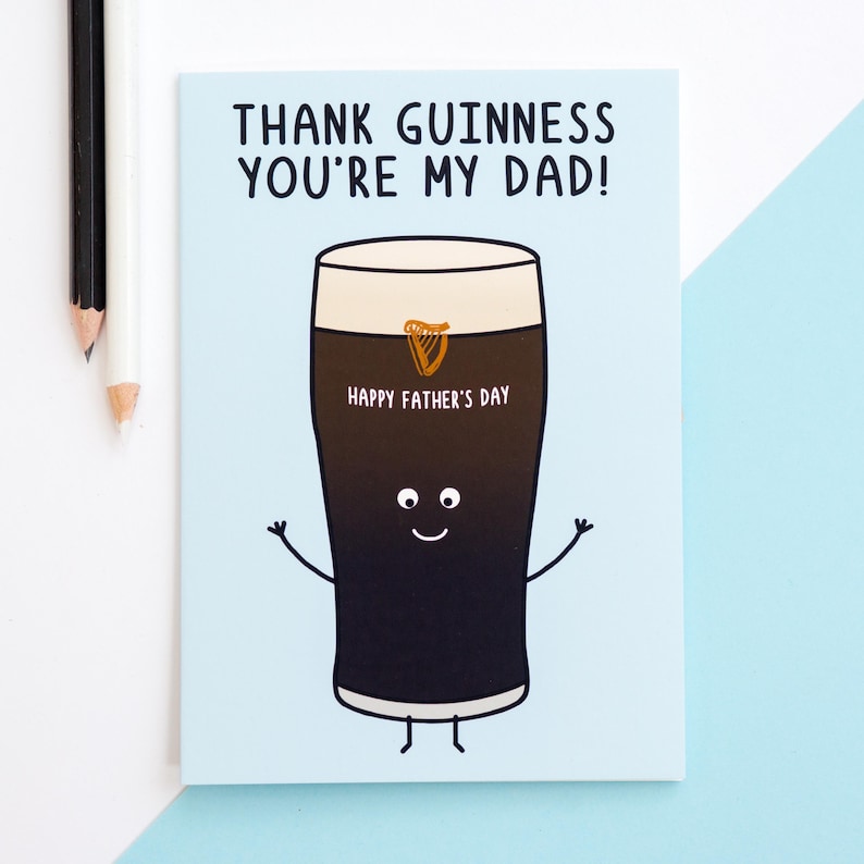 May include: A Father's Day card with a cartoon pint of Guinness. The card reads "THANK GUINNESS YOU'RE MY DAD!" and "HAPPY FATHER'S DAY." The pint has a smiling face, arms, and legs, with a gold harp logo.