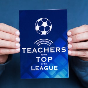May include: A blue card with a white soccer ball graphic and the text "When it comes to teachers you're top of the league".