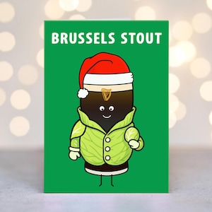 May include: A green greeting card with the words "BRUSSELS STOUT" at the top. The card features a cartoon stout character wearing a Santa hat, a green jacket, and white gloves. The stout has a smiling face.