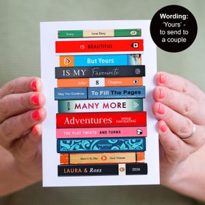 Puede incluir: Una tarjeta de felicitaci&oacute;n rectangular con una pila de lomos de libros coloridos con el texto Every Love Story IS BEAUTIFUL, But Yours IS MY Favourite, After 8 Chapters, To Fill The Pages WITH MANY MORE, Adventures, THE PLOT TWISTS AND TURNS y LAURA & ROSS 2026.
