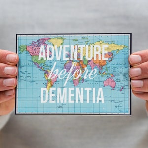 May include: A blue and white world map with the text "Adventure before dementia" printed on it.