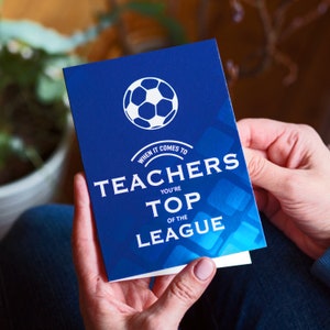May include: Blue card with a white soccer ball and the text "When it comes to teachers you're top of the league".