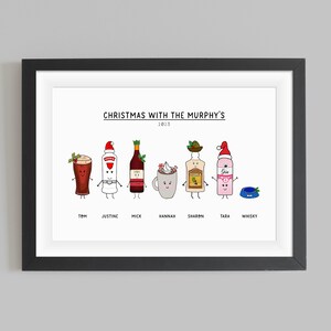 May include: A white framed print with the text "Christmas with the Murphy's 2013" at the top.  The print features a cartoon illustration of seven different drinks, each with a festive hat and a name underneath: Tom, Justine, Mick, Hannah, Sharon, Tara, and Whisky.