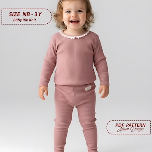 May include: A baby wearing a dusty rose ribbed knit pajama set. The long-sleeved top has a white lace trim around the collar. The set is labeled "SIZE NB - 3Y Baby Rib Knit" and "PDF PATTERN Naum Design".
