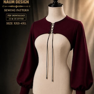 May include: A deep burgundy bolero with long, full sleeves and ribbed cuffs. The front features a round neckline with a central lace-up closure using thin black cords. Text on the image reads: NAUM DESIGN, SEWING PATTERN, PDF DOWNLOAD, A4 & US LETTER, SIZE XXS-4XL.
