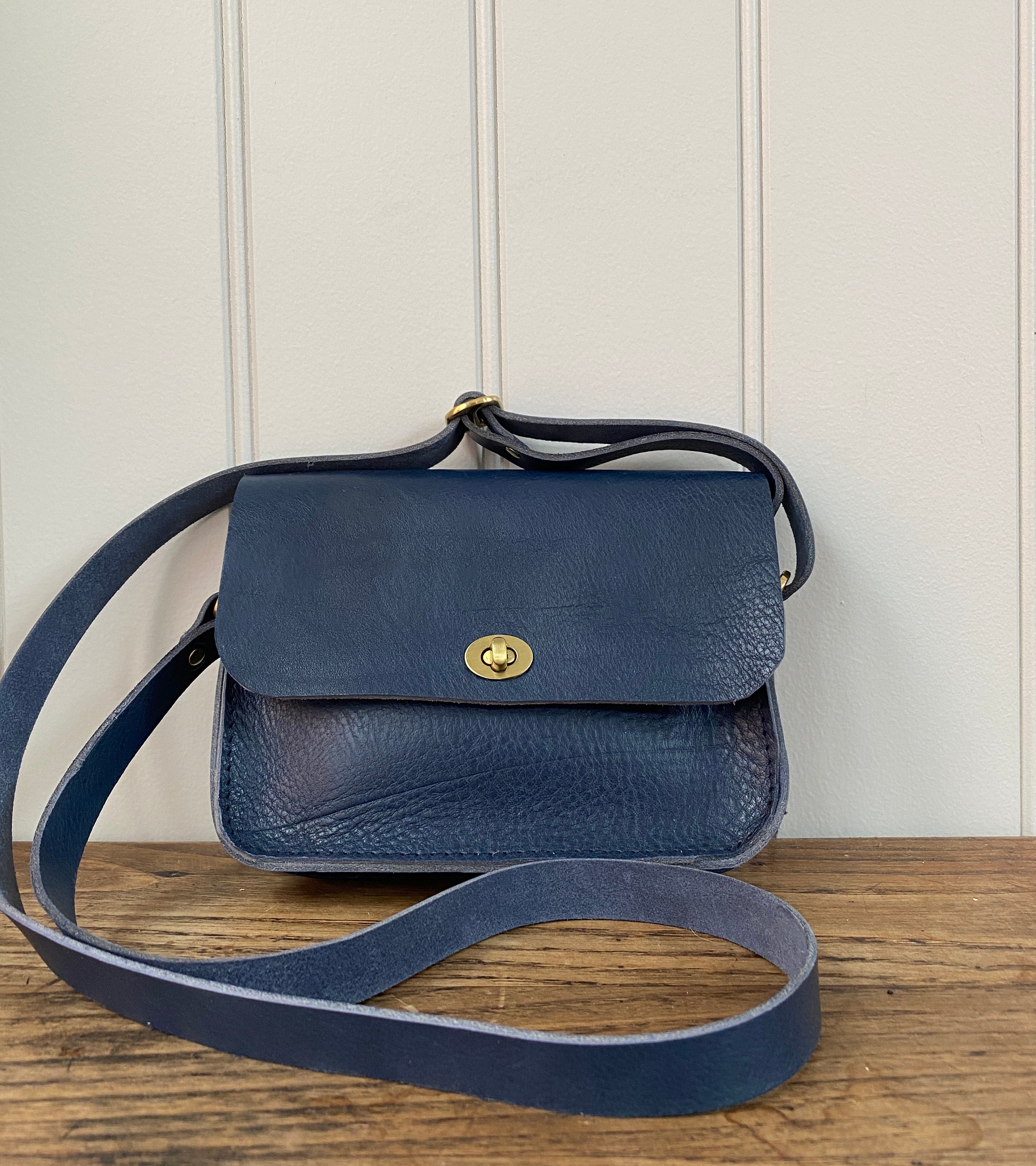 small navy leather handbag