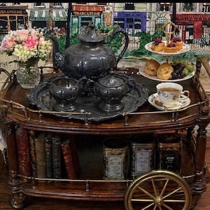 Vintage, silver plated over copper.  Coffee/tea pot, creamer, sugar, bowl, and tray, heavy patina.