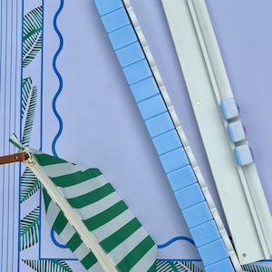 Mahjong Tile Bag positioned next to magnetic racks and pushers that are 20 inches long. Complete American Mahjong Game night set