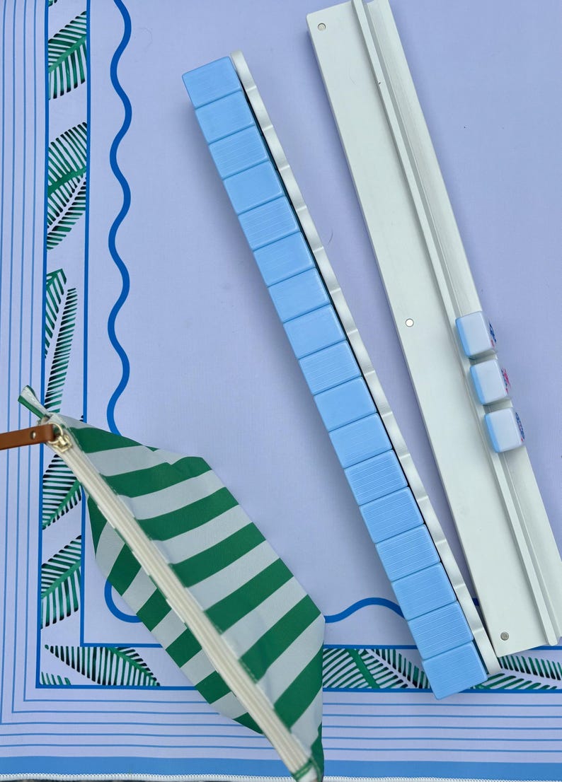 Mahjong Tile Bag positioned next to magnetic racks and pushers that are 20 inches long. Complete American Mahjong Game night set