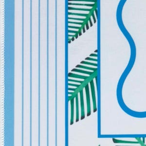 detailed view of coastal mahjong mat border. Featuring custom white stitching,  blue and white stripes, botanical leaves and a wavy line leading you to the calm center of the gameplay space