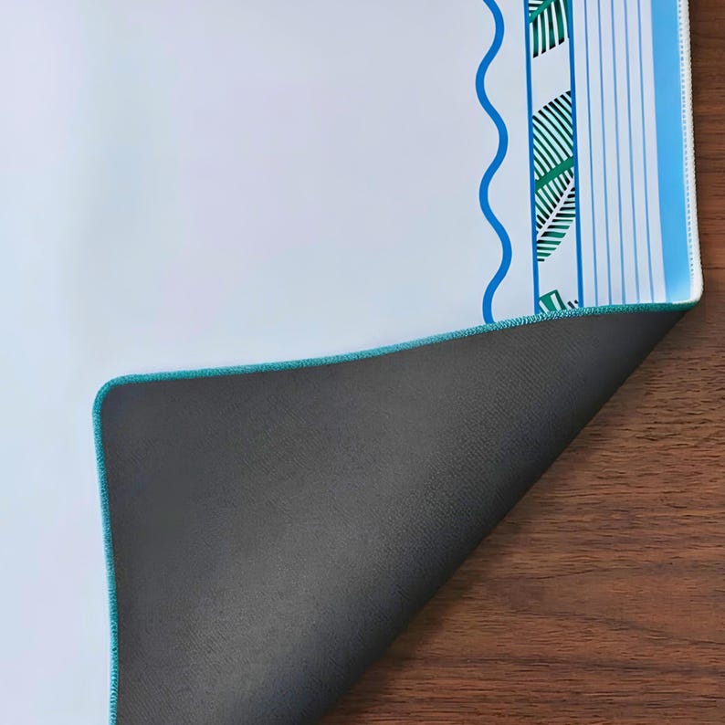 Close up of Coastal Mahjong mat showing non-slip rubber backing, finished stitched edge and premium thickness