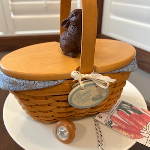 May include: A set of three ceramic mugs with a speckled, matte finish. The mugs are in shades of cream, light gray, and dark gray. Each mug has a simple, minimalist design, perfect for coffee or tea.