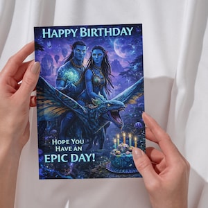 May include: A birthday card with a fantasy illustration of blue-skinned figures and a winged beast. The card displays the text "HAPPY BIRTHDAY" and "HOPE YOU HAVE AN EPIC DAY!" A birthday cake with lit candles is also shown.