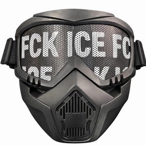 May include: A matte black full-face mask with the text "FCK ICE FC" in white across the perforated visor. The mask has adjustable straps and a built-in ventilation system, suitable for airsoft or paintball.