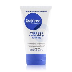 May include: A white tube of Dermend cream for fragile skin. The tube has a blue cap and a blue circle with the brand name. The text "fragile skin moisturizing formula" is displayed prominently. The net weight is 4.5 oz (127g).