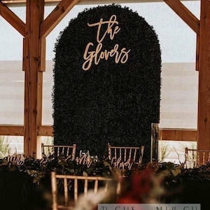 May include: A handmade wooden sign displaying the word "Welcome" in a whimsical font. The sign has a distressed, rustic finish, creating a welcoming feel, ideal for a front door or hallway.