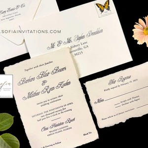 May include: A wedding invitation suite with a rustic, handmade paper texture. The invitation features the names "Barbara Blair Bowers & Matthew Ryan Keaken" in elegant script. The RSVP card includes the text "Kindly respond by February 19, 2025".