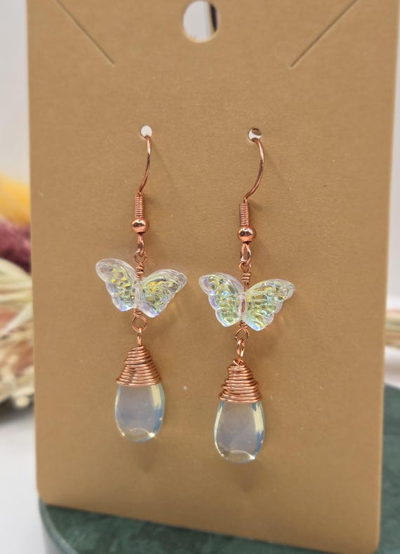 Handmade dainty butterfly and teardrop glass bead dangle earrings, wire-wrapped with copper/rose gold wire