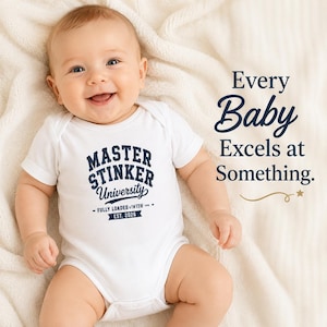 May include: A white short-sleeved baby bodysuit featuring dark blue text that reads "MASTER STINKER University" and "FULLY LOADED WITH EST. 2026". To the right, the text "Every Baby Excels at Something." is printed with a small gold star graphic.