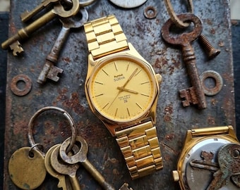 Vintage HMT SURYA mechanisch handopwindbaar 17 juwelen herenpolshorloge gouden wijzerplaat